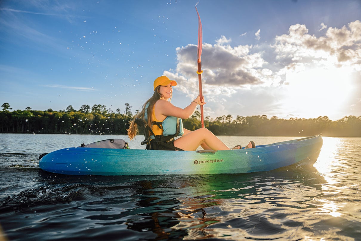 woman paddles a sit-on-top recreational kayak from Perception Kayaks