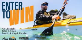 Kayaker paddling a kayak using the tetra Ultralight 2-piece Posi-Lok Kayak Paddle