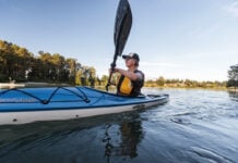 Woman paddling Eddyline kayak. The brand was recently acquired by Jackson Kayak.