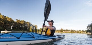 Woman paddling Eddyline kayak. The brand was recently acquired by Jackson Kayak.