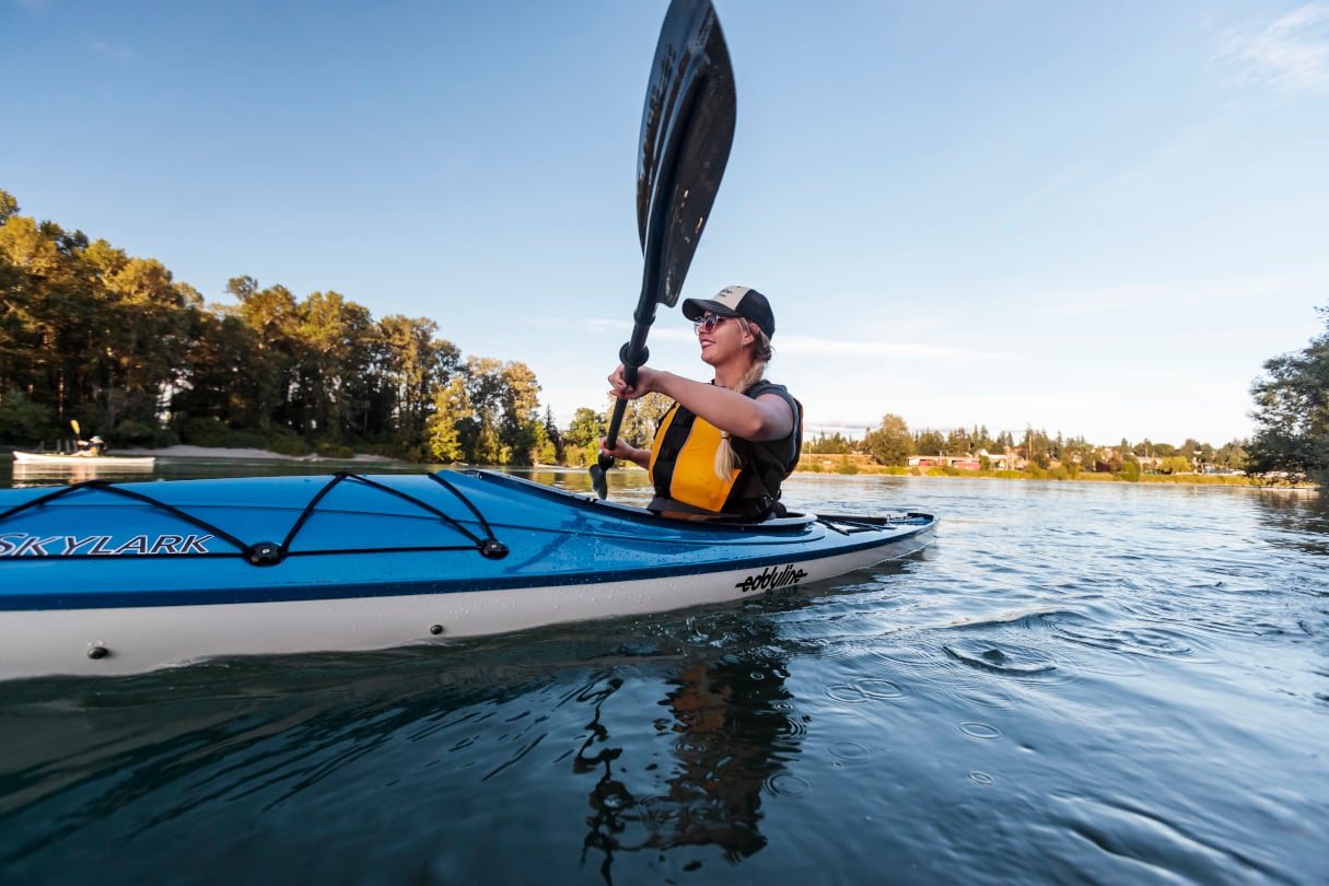 Woman paddling Eddyline kayak. The brand was recently acquired by Jackson Kayak.