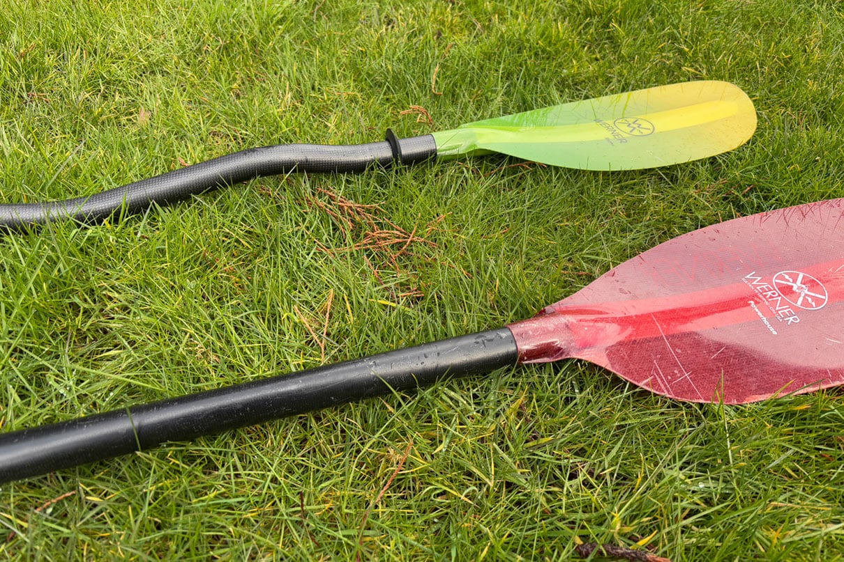 Comparing a straight shaft kayak paddle (foreground) with a bent shaft (background)