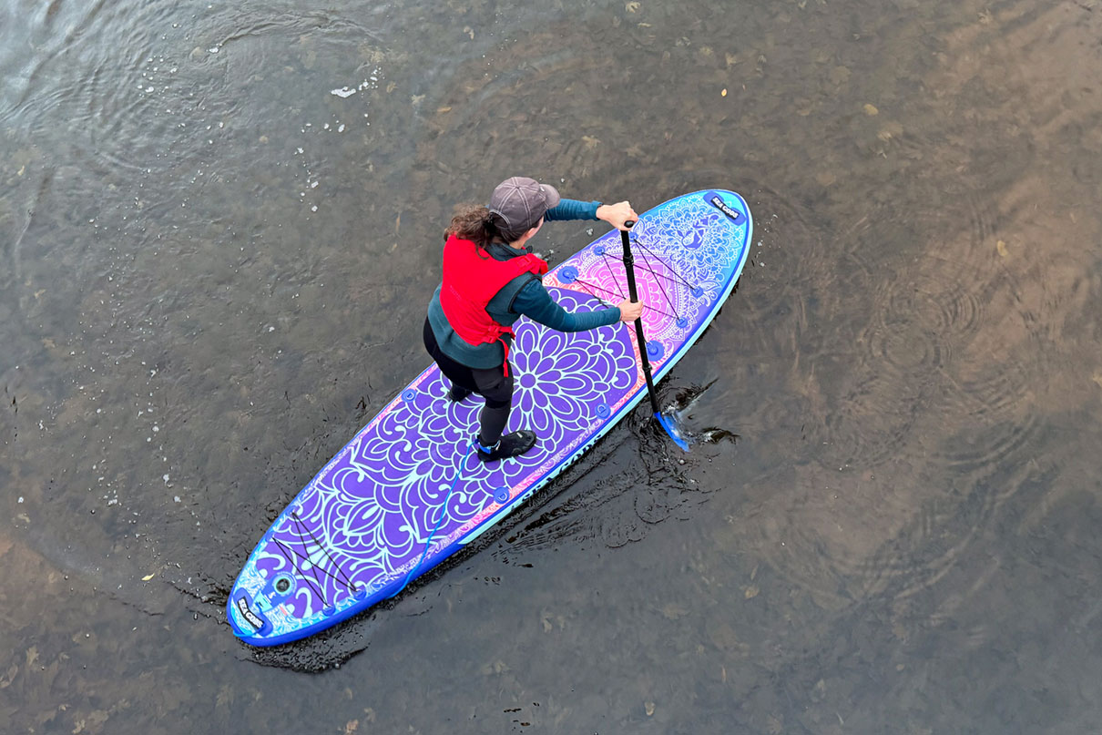 person paddles the Sea Gods Diatom paddleboard