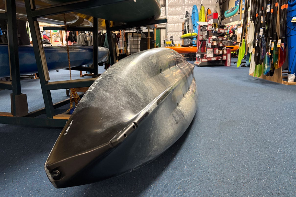 multi-hull Hobie Quest sit-on-top kayak sits overturned at Oregon Paddle Sports