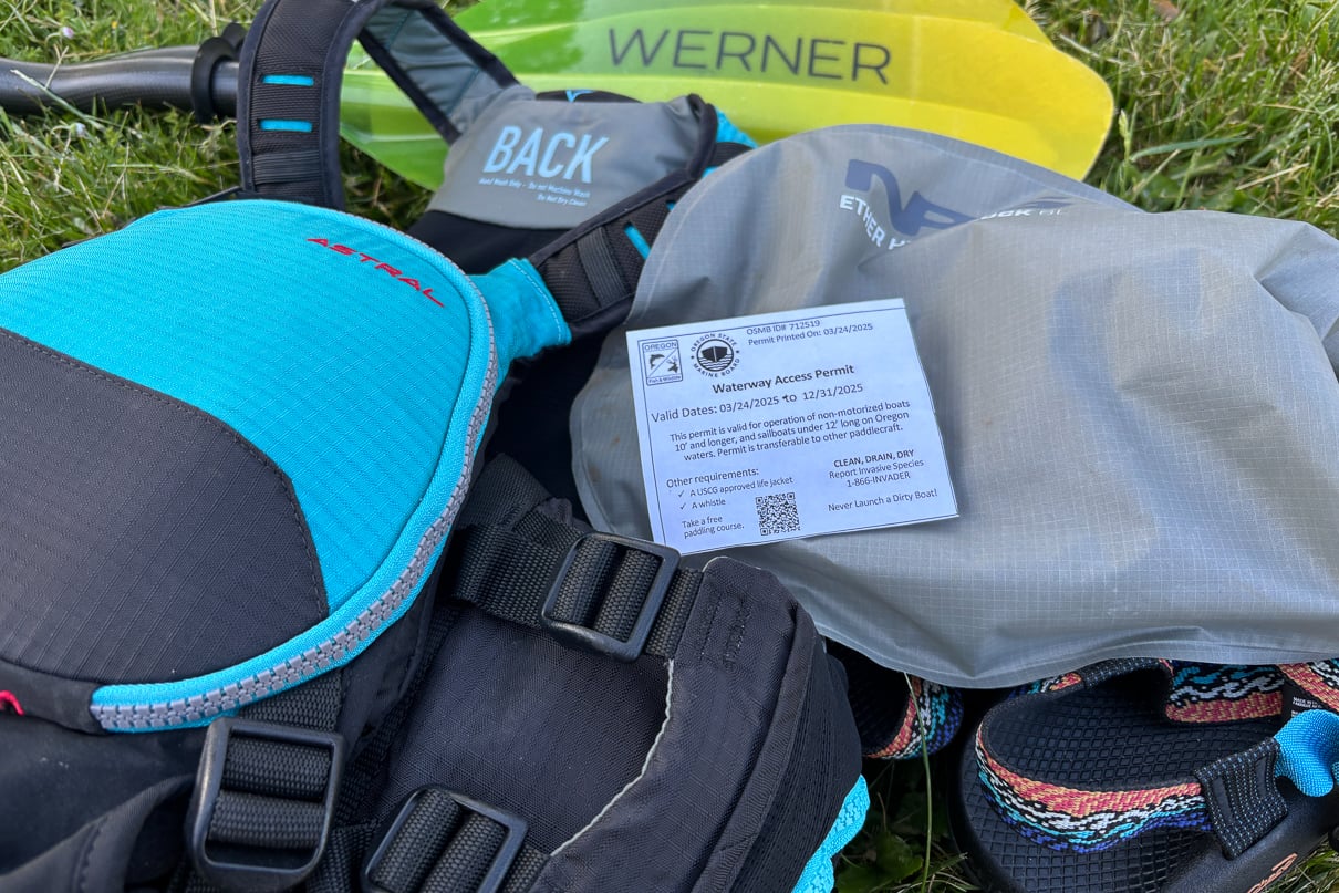 Image of the Oregon Waterway Access Permit on top of a pile of paddling gear