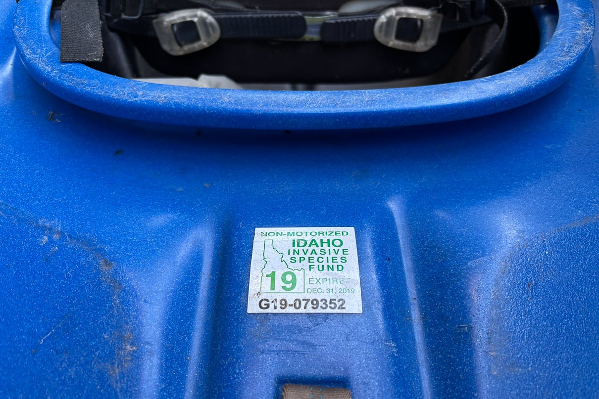 Idaho's Aquatic Invasive Species Sticker affixed to a whitewater kayak.