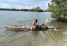 Peter Frank sits in a Canoe in Florida