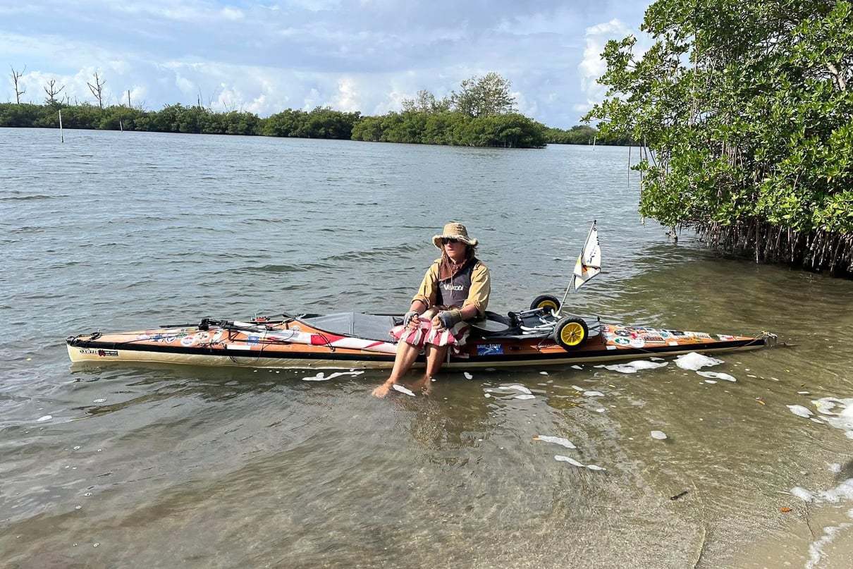 Peter Frank sits in a Canoe in Florida