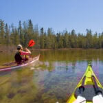 kayaking over the Grass River in Michigan