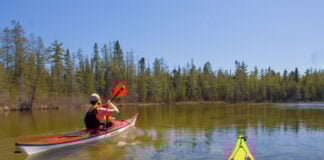 kayaking over the Grass River in Michigan