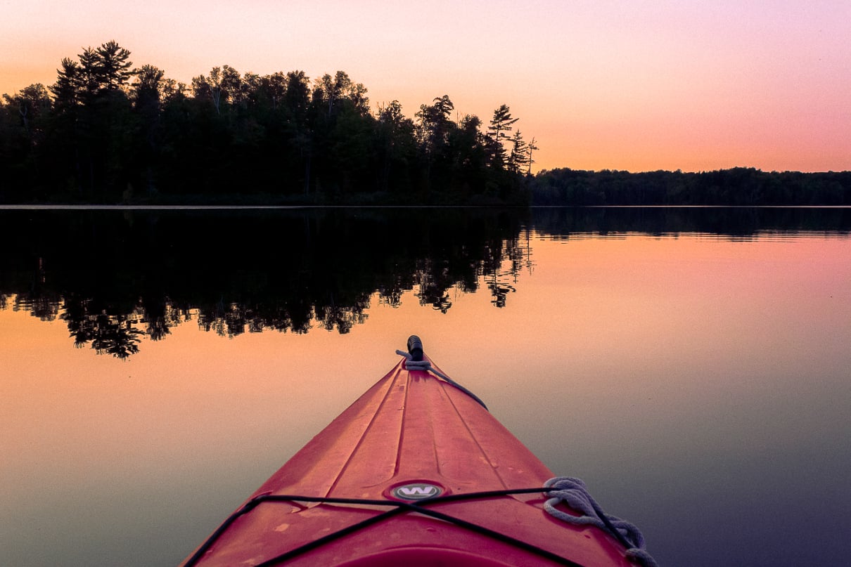 Kayaking the Big Island Lakes Wilderness in the Upper Peninsula at Sunset